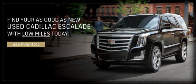 Escalade driving in a city street - see inventory button
